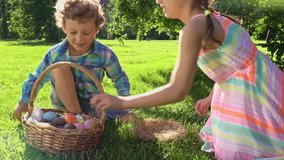 Children joyfully participate in an Easter egg hunt in a sunny park. They gather colorful eggs into a wicker basket and walk barefoot on lush grass, enjoying a cheerful spring celebration. - Powered by Shutterstock - Get 15% off with code: PIKWIZARD15