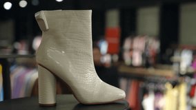 These chic beige ankle boots feature a high heel, making them ideal for trendy outfits and stylish occasions - Powered by Shutterstock - Get 15% off with code: PIKWIZARD15