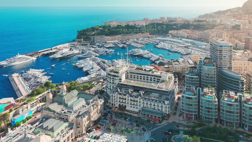 Aerial view of the Monte-Carlo casino in Monaco. Luxurious supercars in front of the hotel. City center of the Principality of Monaco. Famous casino and luxury buildings in Monte Carlo, Monaco