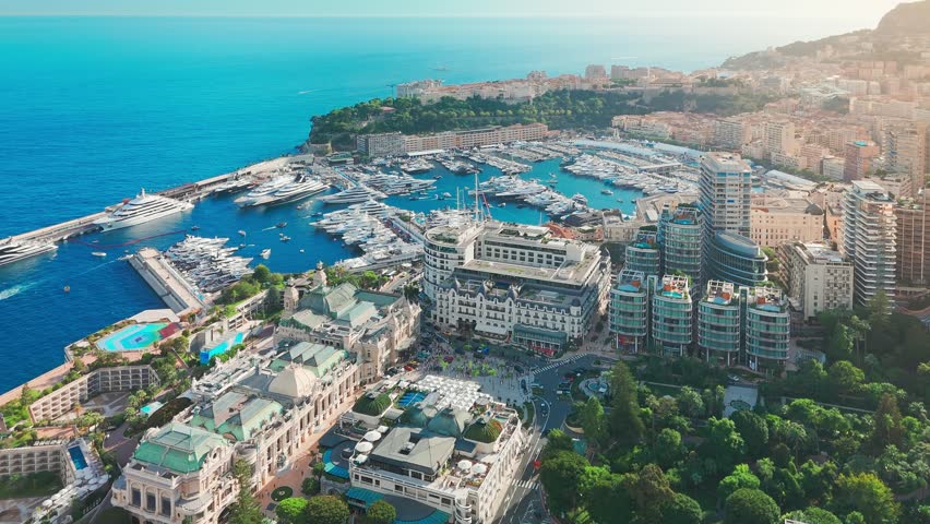 Aerial view of the Monte-Carlo casino in Monaco. Luxurious supercars in front of the hotel. City center of the Principality of Monaco. Famous casino and luxury buildings in Monte Carlo, Monaco
