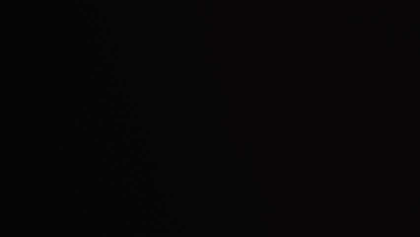 Abstract light leaks and film burns on Dark Background Lights flash Effects. High quality 4k footage