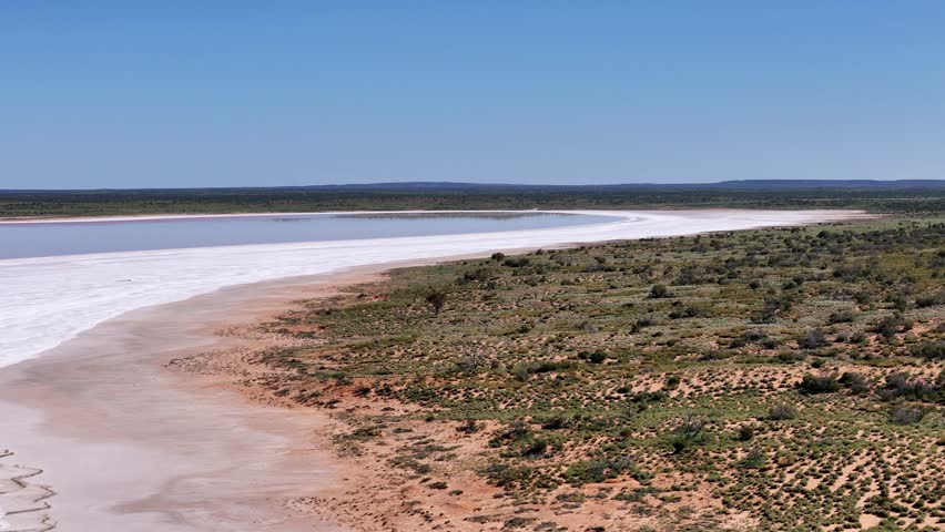 Aerial view of Lake Amadeus salty mud basin is the largest salt lake in Northern Territory Australia, about 50 km north of Uluru or Ayers Rock, stretching 180 kilometers long and 10 kilometers wide