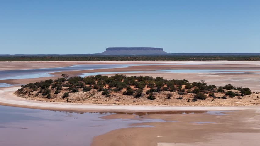 Aerial view of Lake Amadeus salty mud basin is the largest salt lake in Northern Territory Australia, about 50 km north of Uluru or Ayers Rock, stretching 180 kilometers long and 10 kilometers wide