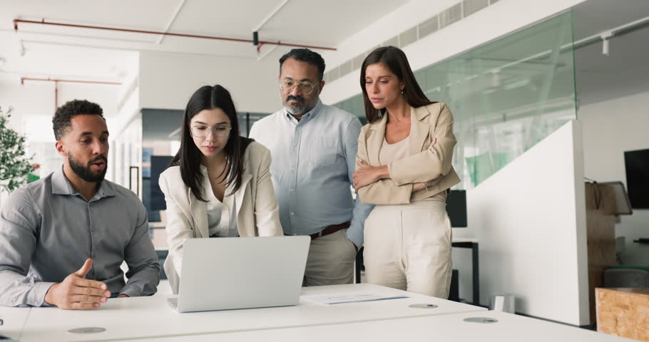 Young project manager woman presenting completed task to diverse team of colleagues, showing online presentation, software product, application on laptop. Business group working at computer together