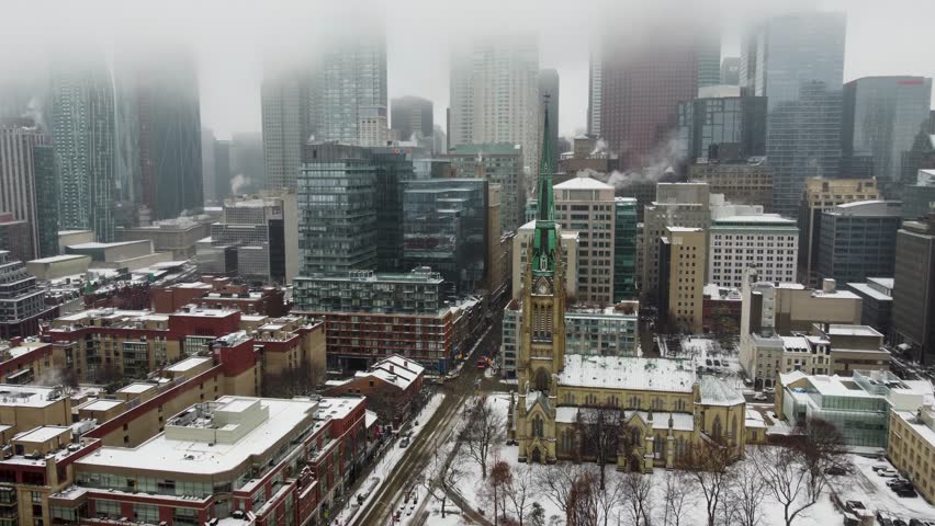 Aerial winter view of downtown Toronto and Cathedral Church of St. James 4K