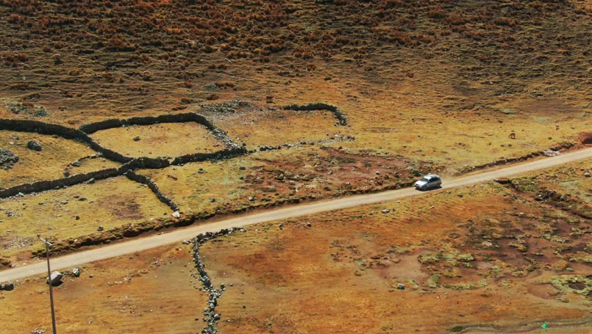 Vehicle traveling around the Inca ruins of Chaullacocha, Cusco. Aerial