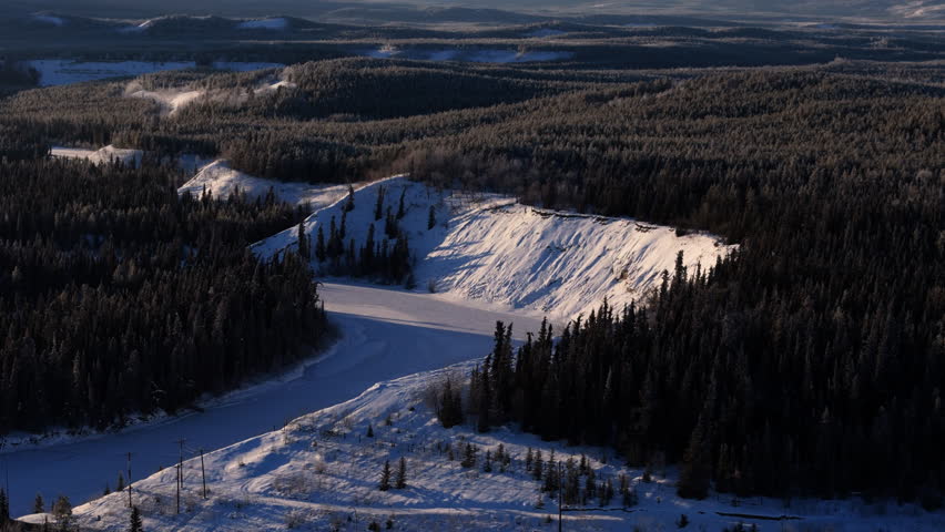 Forests Over Edge Of Cliffs Along Yukon River In Canada. Aerial Drone Shot