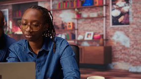 Freelancers filling in spreadsheets on laptop by entering data from report papers, analyzing figures at the end of the month. African american man and woman working from home. Camera A. - Powered by Shutterstock - Get 15% off with code: PIKWIZARD15