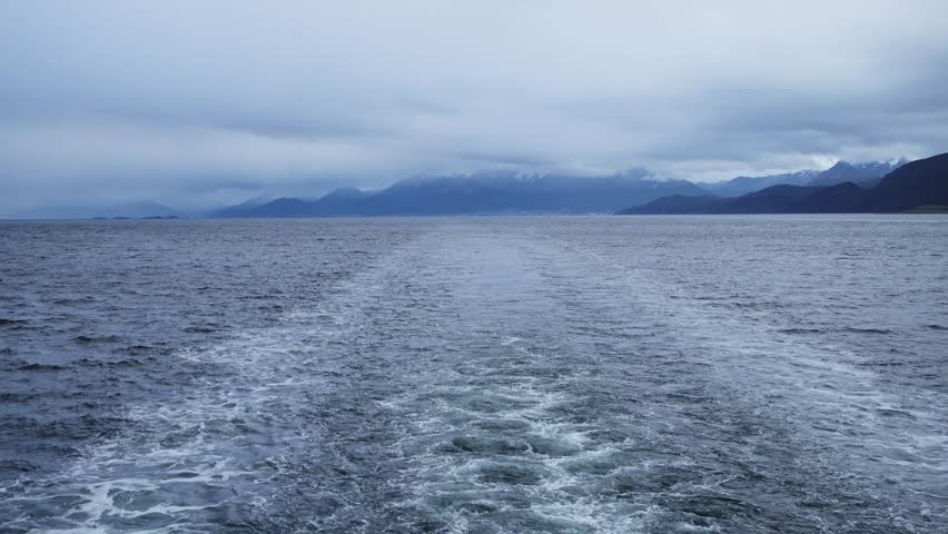 Antarctica Cruise Ship Leaving Port from Ushuaia in the Beagle Channel on the Way to Antarctic Holiday Vacation, Setting Sail from Ushuaia Harbour, the Harbor Port in Argentina in the Beagle Channel