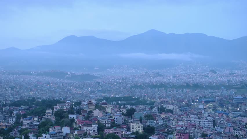 Kathmandu Cityscape in Nepal at Night, Elevated Aerial View from Monkey Temple of Beautiful City of Kathmandu with Mountains Scenery and Houses and Buildings from Above in Blue Hour