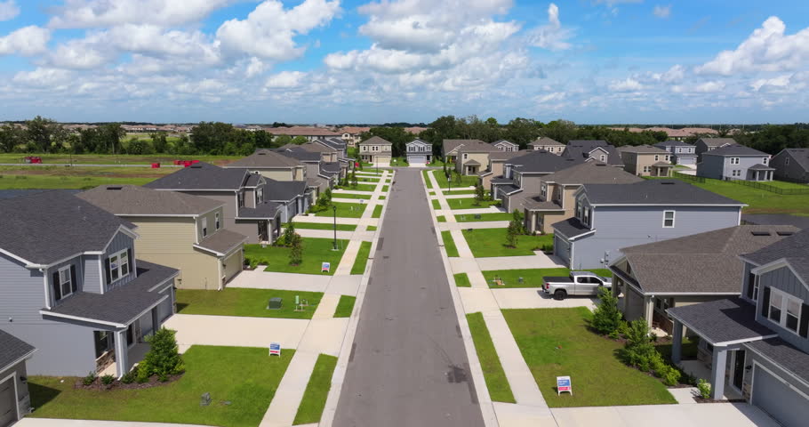 American gated community houses in rural US suburbs. View from above of large residential homes in small town in southwest Florida