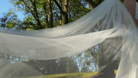 Bride and groom holding each other hands under wedding veil at wedding day. Close up - Powered by Shutterstock - Get 15% off with code: PIKWIZARD15