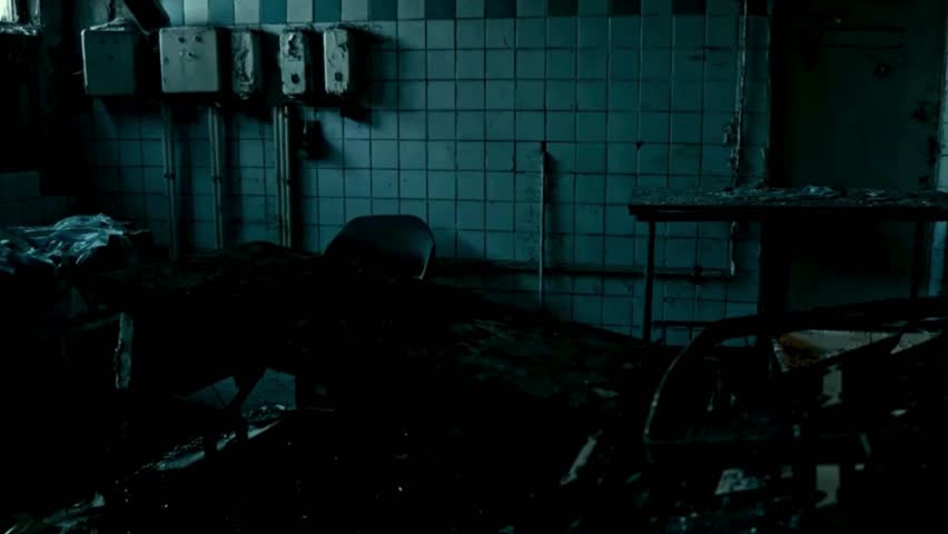 A dark, abandoned room with flickering lights, peeling walls, and eerie shadows. Perfect for horror films, psychological thrillers, and suspense movie scenes.