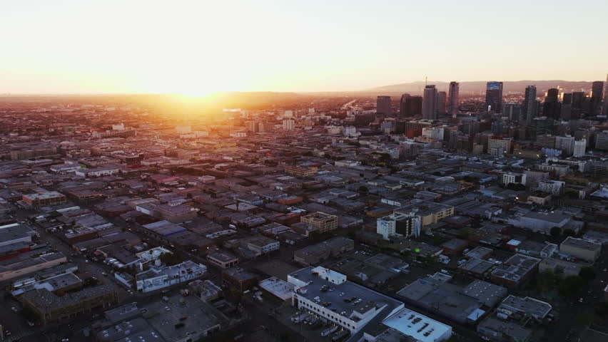 An aerial view of the industrial Skid Row neighborhood in the downtown of Los Angeles city at sunset in California, United States