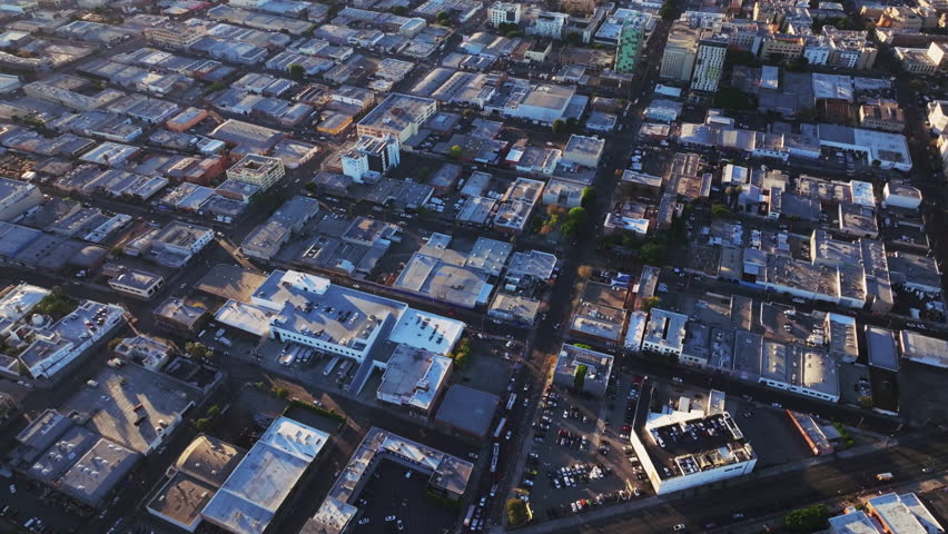 An aerial footage of the Skid Row neighborhood and the urban skyline of Los Angeles city, USA, on a sunny day