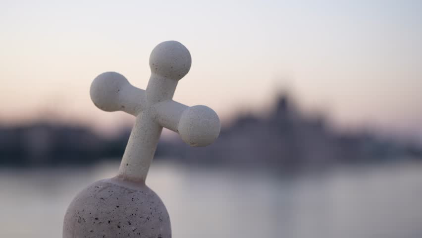 Budapest, Hungary - September 22, 2024: Parliament in Budapest with the Leaning Cross (National Symbol of Hungary)