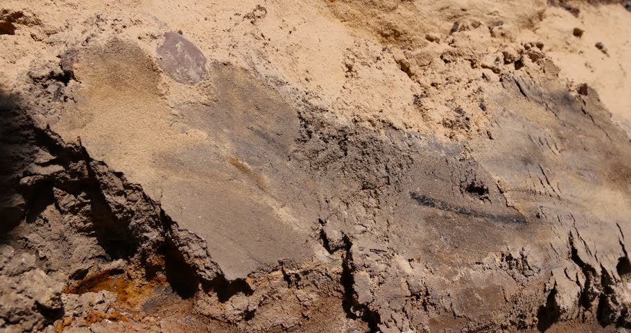 a deep hole in the ground on the site of which a road was started