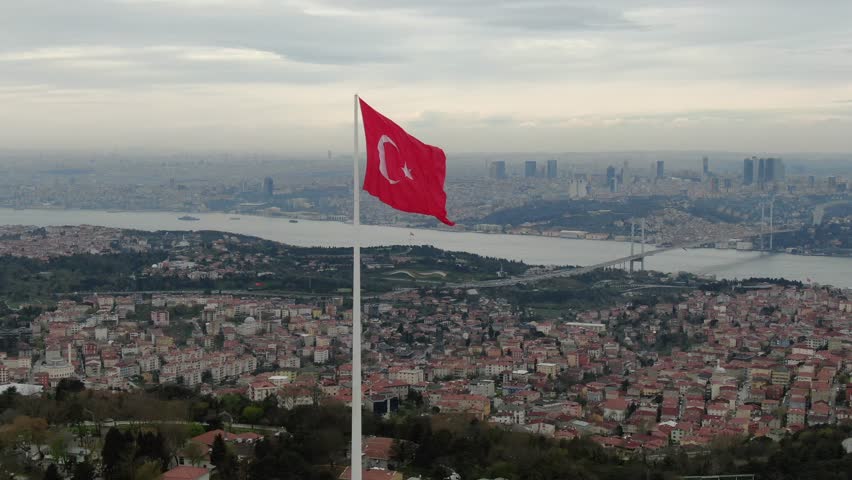 Istanbul Bosphorus and Turkish flag aerial shot. Turkish flag and bridge drone image