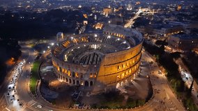 4k Aerial View of Beautiful sunset over the illuminated Colosseum in Roma with a vibrant skyline and city lights. Italy - Powered by Shutterstock - Get 15% off with code: PIKWIZARD15