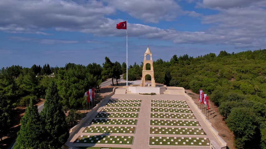 The Turkish flag waves at Gallipoli  57th Infantry Regiment Memorial, honoring fallen soldiers. This historic battlefield reflects patriotism, bravery, and a solemn atmosphere of remembrance.