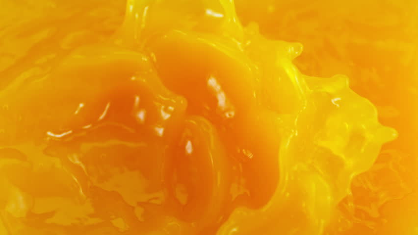 Super Slow Motion Detail Shot of Pouring Fresh Orange Juice at 1000fps.