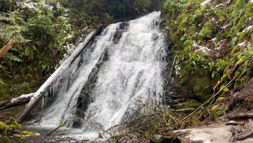 Water flowing over Dickerson falls near Bremerton, Washington