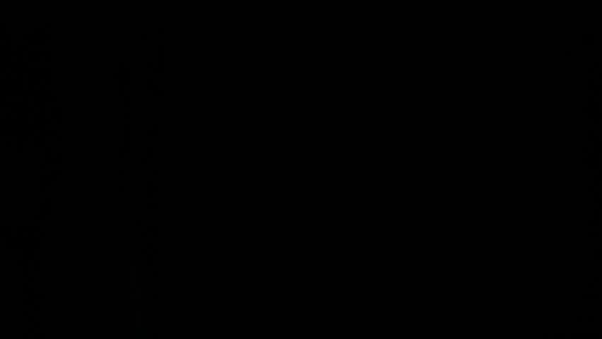 Super Slow Motion Detail Shot of Flying and Rotating Tennis Ball and Smoke Effect at 1000 fps.