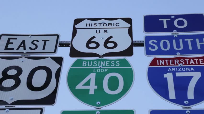 Historic Route 66 along with other streets signs, notably 180 East, Business Loop 40, and Interstate 17 in Arizona.