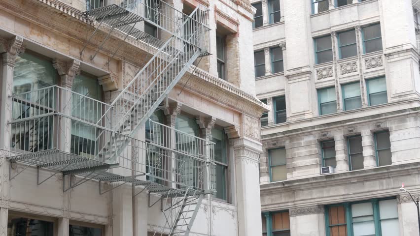 New York City Manhattan Soho fashion district near Broadway street. USA urban building facade, old classic american architecture. Shopping in NYC, United States. Business and residential real estate.