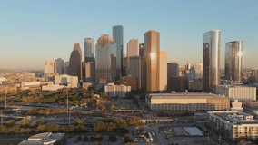 Aerial view highlights the vibrant skyline of Downtown Houston, showcasing its modern architecture and lush green spaces that embody the essence of urban life in this dynamic city. Houston, Texas, USA - Powered by Shutterstock - Get 15% off with code: PIKWIZARD15