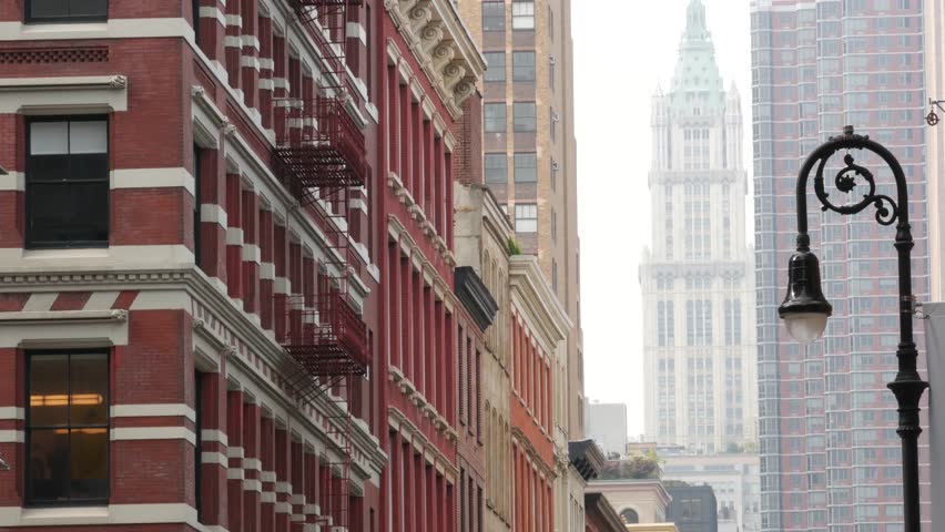 New York City Manhattan Soho fashion district near Broadway street. USA urban building facade, old american architecture. Shopping in NYC, United States. Business and residential real estate. Lantern.