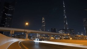 Explore Dubai Downtown at night with skyscrapers, skyline, and illuminated highway - Powered by Shutterstock - Get 15% off with code: PIKWIZARD15