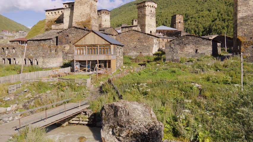 Ancient stone towers rise above landscape, leaving traces of bygone era, past with present in charming village of Ushguli in Svanentia in Georgia.