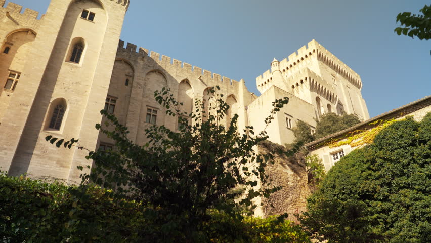 Fortified walls and towers with battlement of rear part of the Palais des Papes in Avignon, France