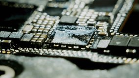 Close-up macro shot of an audio codec microchip being soldered onto a circuit board using a soldering iron. The high-resolution 4K 60fps video demonstrates the delicate installation process. - Powered by Shutterstock - Get 15% off with code: PIKWIZARD15