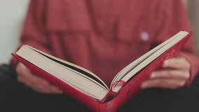 Close-up of a woman turning the page of a book, a girl relaxing at home with a book in her hands. the girl is reading. - Powered by Shutterstock - Get 15% off with code: PIKWIZARD15