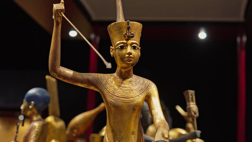 Royal golden statue of ancient Egyptian pharaoh, ancient exhibit in museum. Tutankhamen or Tutankhamun - famous king of Egypt - Powered by Shutterstock - Get 15% off with code: PIKWIZARD15