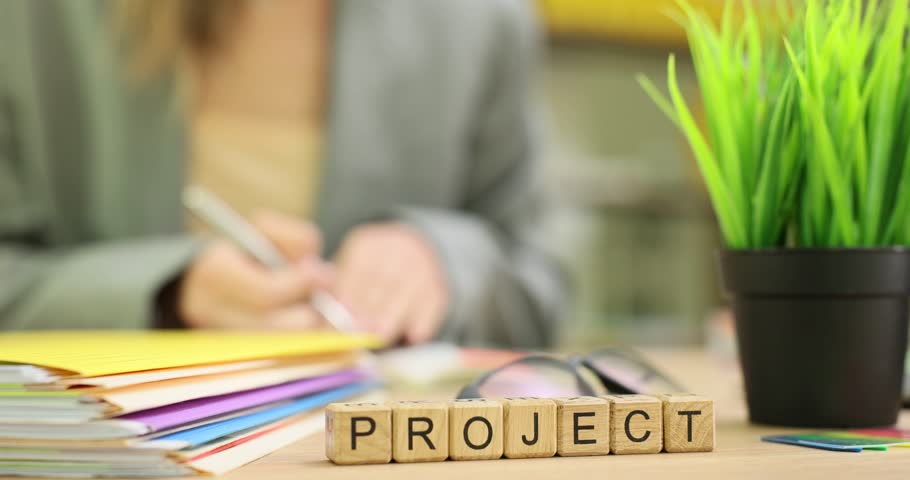 Word Project against woman making notes at workplace. Female financial manager prepares documentation for new cooperative contract with partner