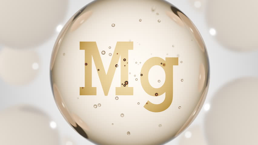 A golden glossy sphere with mineral Mg. Magnesium pill capsule. Abstract 3D bubble drop background