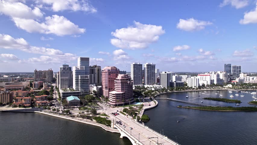 Establishing drone shot of One Flagler, Phillips Point Building and West Palm Beach cityscape in Florida, USA