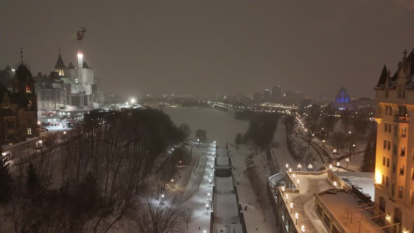 Chateau Laurier, Ottawa Union Station and parliment building  at night drone aerial