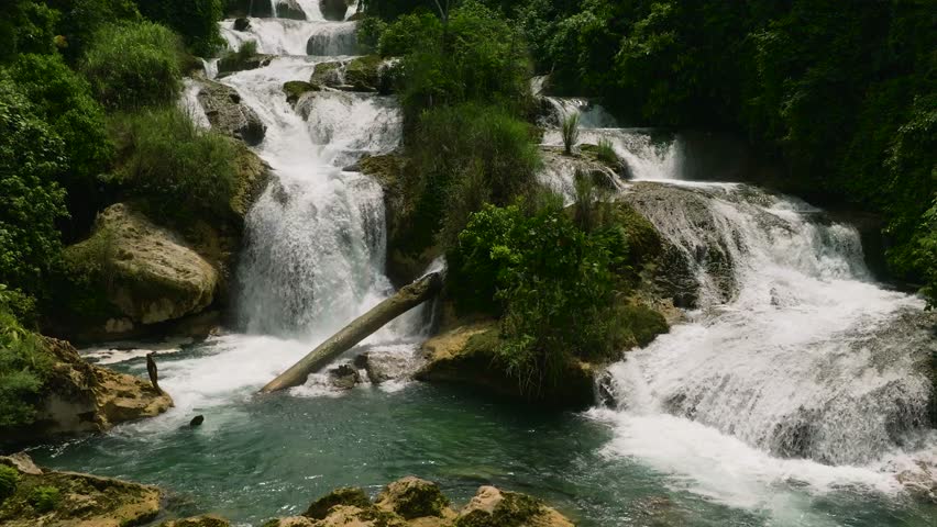 Aliwagwag waterfalls wateralls with cold white water. Mindanao, Philippines. Slow motion.