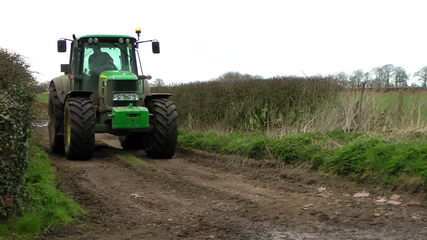 Tractor driving along a farm track