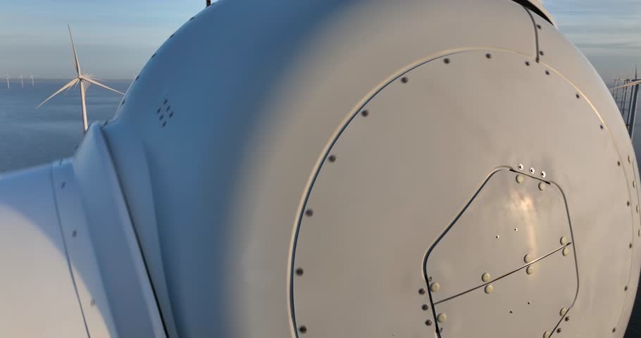 aerial drone footage of a large wind turbine on open water along the Afsluitdijk, The Netherlands. Sustainable energy, electricity by wind power.
