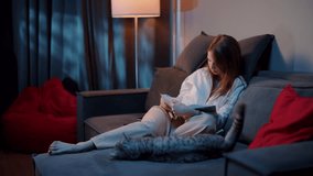 Woman Reading a Book on the Couch - Powered by Shutterstock - Get 15% off with code: PIKWIZARD15