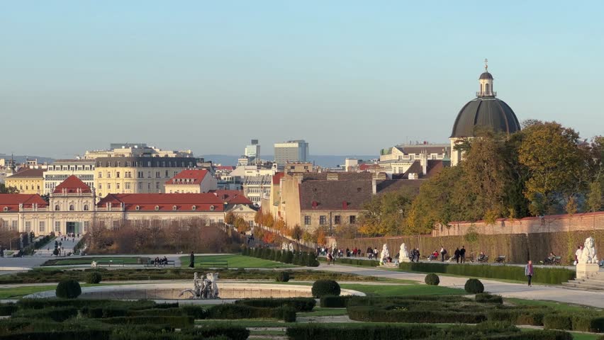 Belvedere Gardens at autumn early evening before sunset, Vienna, Austria, view while panning
