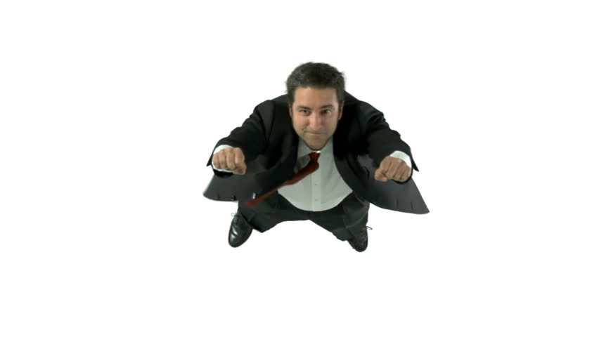 Man in a business suit flies in front of a white background.