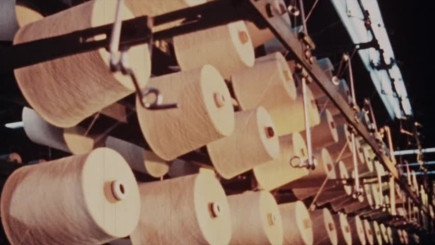 Rolling a hasp with threads in the textile factory 
