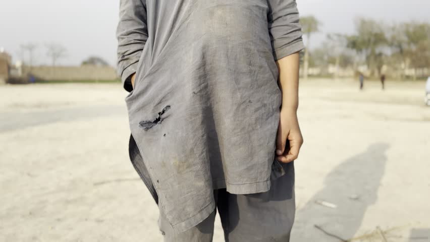 A 4K video of a poor little boy with a torn dress smiling would capture an incredibly poignant and heartwarming moment in stunning detail. The texture of the fabric, the dirt smudges on his face.
