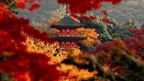 Iconic pagoda inKiyomizu-dera Temple in Kyoto, Japan, stands majestically against a golden sunset, surrounded by vibrant red and yellow autumn foliage. - Powered by Shutterstock - Get 15% off with code: PIKWIZARD15